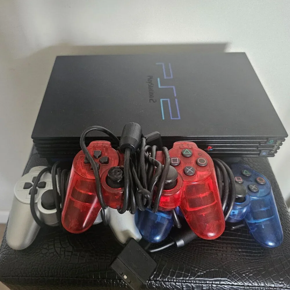 Playsation 2 (PS2 Fat) with controllers and games and PS2 Slim